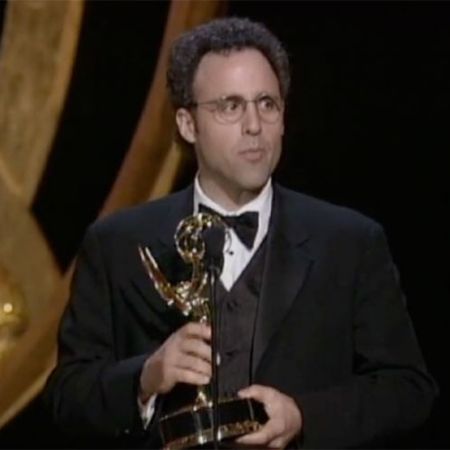 Kario Salem holding his award.